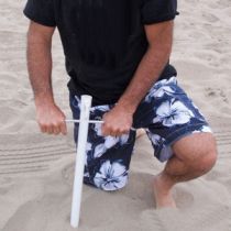 step 1 - screw grounding pole into sand